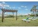 Relaxing beach access with lounge chairs and a pergola at 205 74Th Ave. N # 1603, Myrtle Beach, SC 29572