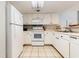White kitchen with appliances, view of another part of kitchen at 205 74Th Ave. N # 1603, Myrtle Beach, SC 29572