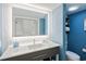 Modern bathroom features a sleek vanity with illuminated mirror, toilet, and tiled backsplash at 2106 N Ocean Bl N Ocean Blvd. # 211, Myrtle Beach, SC 29577