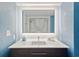Modern bathroom features a sleek vanity with illuminated mirror and tiled backsplash at 2106 N Ocean Bl N Ocean Blvd. # 211, Myrtle Beach, SC 29577