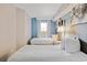 Tastefully decorated bedroom with twin beds, window view, and modern decor at 2106 N Ocean Bl N Ocean Blvd. # 211, Myrtle Beach, SC 29577