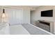 Comfortable bedroom featuring a plush bed, closet, dresser, and a wall-mounted TV at 2106 N Ocean Bl N Ocean Blvd. # 211, Myrtle Beach, SC 29577