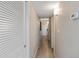 Hallway with wood-look floors and white closet doors at 2106 N Ocean Bl N Ocean Blvd. # 211, Myrtle Beach, SC 29577
