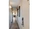Hallway with wood-look floors and art on the walls leading to the living room at 2106 N Ocean Bl N Ocean Blvd. # 211, Myrtle Beach, SC 29577