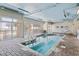 A pristine indoor pool with comfortable lounge seating and ample natural light at 2106 N Ocean Bl N Ocean Blvd. # 211, Myrtle Beach, SC 29577