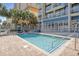 A beautiful outdoor pool surrounded by palm trees and lounge chairs in the sunshine at 2106 N Ocean Bl N Ocean Blvd. # 211, Myrtle Beach, SC 29577