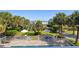 Overhead view of the sparkling swimming pool surrounded by palm trees, lawn chairs, and umbrellas overlooking the ocean at 2106 N Ocean Bl N Ocean Blvd. # 211, Myrtle Beach, SC 29577