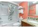 Clean bathroom with coral walls, shower, and granite vanity at 2311 South Ocean Blvd. # 371, Myrtle Beach, SC 29577