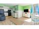 Condo living room with TV and ocean view at 2311 South Ocean Blvd. # 371, Myrtle Beach, SC 29577