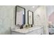 Double vanity bathroom with marble countertop and stylish mirrors at 244 Gloucester Way, Little River, SC 29566
