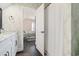 Bathroom with shower and access to a bedroom at 244 Gloucester Way, Little River, SC 29566