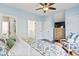 Spacious bedroom with a dresser, seating area, and ceiling fan at 244 Gloucester Way, Little River, SC 29566