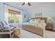 Bright bedroom with comfortable seating and a ceiling fan at 244 Gloucester Way, Little River, SC 29566