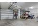 Spacious garage with golf cart, bikes, and ample storage at 244 Gloucester Way, Little River, SC 29566
