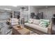 Relaxing garage apartment with wicker furniture and a fireplace at 244 Gloucester Way, Little River, SC 29566