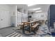 Finished garage apartment with table, seating area, and a heater at 244 Gloucester Way, Little River, SC 29566