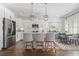Modern kitchen with island, stainless steel appliances, and breakfast nook at 244 Gloucester Way, Little River, SC 29566