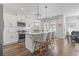 Bright kitchen featuring white cabinets, an island, and stainless steel appliances at 244 Gloucester Way, Little River, SC 29566