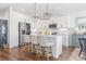 Modern kitchen with island, stainless steel appliances, and breakfast nook at 244 Gloucester Way, Little River, SC 29566