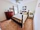 Charming bedroom featuring a four-poster bed and neutral decor at 344 Tall Palms Way, Little River, SC 29566