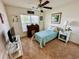 Cozy bedroom with a stylish desk, window, and ceiling fan at 344 Tall Palms Way, Little River, SC 29566