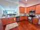 View of kitchen featuring granite countertops, stainless steel appliances and hardwood floors at 344 Tall Palms Way, Little River, SC 29566