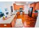 Spacious kitchen with stainless steel appliances, granite countertops, and hardwood floors at 344 Tall Palms Way, Little River, SC 29566