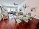 View of dining and living areas with hardwood floors and stylish decor at 344 Tall Palms Way, Little River, SC 29566