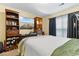 Bedroom with a double bed, workspace, and built-in shelving at 3786 Hitchcock Way # 312, Myrtle Beach, SC 29577