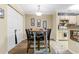 Small dining area with four-seat table and chairs, near kitchen at 3786 Hitchcock Way # 312, Myrtle Beach, SC 29577