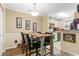Small dining area with a wooden table and four chairs, adjacent to kitchen at 3786 Hitchcock Way # 312, Myrtle Beach, SC 29577