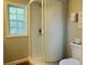 Small bathroom with a rounded shower and toilet at 3866 Highway 17 Business # C-3, Murrells Inlet, SC 29576