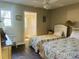 Bedroom with two twin beds, ensuite bathroom, and window at 3866 Highway 17 Business # C-3, Murrells Inlet, SC 29576