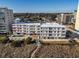 Aerial view of condo building near the beach with a pool at 3901 S Ocean Blvd. # 228, North Myrtle Beach, SC 29582