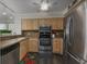 Galley kitchen with stainless steel appliances and light wood cabinets at 3901 S Ocean Blvd. # 228, North Myrtle Beach, SC 29582