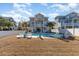 Private backyard with pool and lounge chairs at 406 Pine Ave., Murrells Inlet, SC 29576