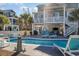 Inviting pool area with lounge chairs and landscaping at 406 Pine Ave., Murrells Inlet, SC 29576