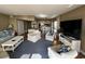 Bright living room with comfy seating, large TV, and hardwood floors at 423 Parker Dr. # 511, Pawleys Island, SC 29585