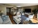 Living area features hardwood floors, comfy seating, and a large TV at 423 Parker Dr. # 511, Pawleys Island, SC 29585