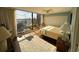 Main bedroom with large windows, ocean view, and a ceiling fan at 423 Parker Dr. # 511, Pawleys Island, SC 29585