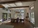 Bright dining room with large windows, modern chandelier, and stylish decor at 429 Harbour View Dr., Myrtle Beach, SC 29579