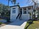 Beautiful white exterior elevation showcasing a modern home with a two-car garage at 429 Harbour View Dr., Myrtle Beach, SC 29579