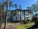 Two-story home with white siding, stone accents, and landscaping at 429 Harbour View Dr., Myrtle Beach, SC 29579