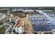 A scenic aerial view showcases the condo complex, marina, and surrounding marshland with access to the waterway at 4390 Bimini Ct. # 206-C, Little River, SC 29566