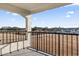 The balcony overlooks a road and a marina, offering scenic views and outdoor relaxation at 4390 Bimini Ct. # 206-C, Little River, SC 29566