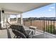 Spacious balcony with seating offers great views of the surrounding landscape and waterfront at 4390 Bimini Ct. # 206-C, Little River, SC 29566