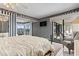 Bedroom with sliding glass doors to a balcony overlooking a marina at 4390 Bimini Ct. # 206-C, Little River, SC 29566