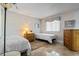 Bright bedroom with tile flooring, two twin beds, and a view of the outdoors at 4390 Bimini Ct. # 206-C, Little River, SC 29566