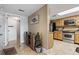 Inviting condo entryway that leads to a delightful kitchen with modern stainless steel appliances and granite countertops at 4390 Bimini Ct. # 206-C, Little River, SC 29566