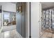 Hallway with nautical-themed decor leads to a bathroom and the condo's common living space at 4390 Bimini Ct. # 206-C, Little River, SC 29566